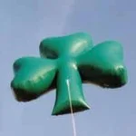 Green shamrock advertising blimp rental for St. Patrick's Day promotions
